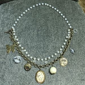 Multi-strand charm necklace with locket